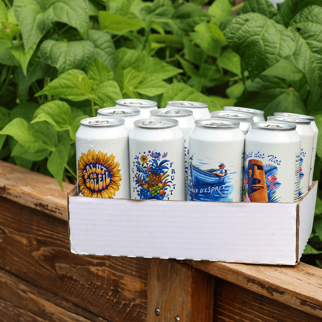 Canettes de bières des 4 variétés sans alcool : Tutti Frutti, Salut au Soleil, Goût des Îles et Paix d'Esprit.